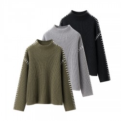 The new casual knitted sweater with a contrasting color and patchwork line design is sleeveless and simple